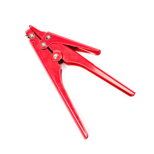 Red metal caulking gun with trigger handle and nozzle.
