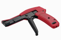 Red and black cable tie gun tool for fastening nylon cable ties.