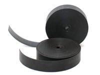 Black adhesive-backed velcro tape roll with hook and loop sides separated.