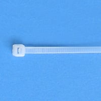 White cable tie on a blue background.