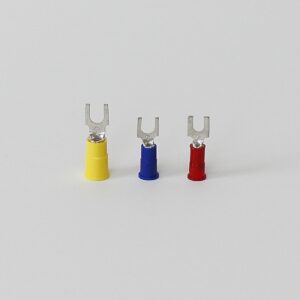 Three insulated spade connectors in yellow, blue, and red arranged in a row.