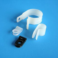 White smartphone accessories and a black phone on a blue background.