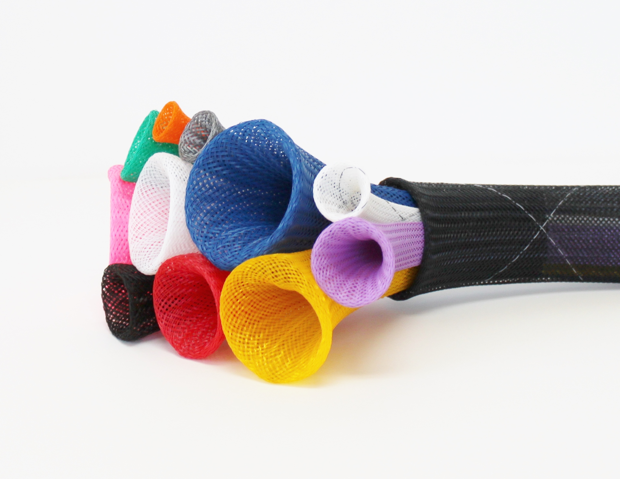 Colorful mesh cable sleeves in various colors arranged on a black braided cable.