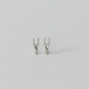 Two silver spade connector terminals on a white background.