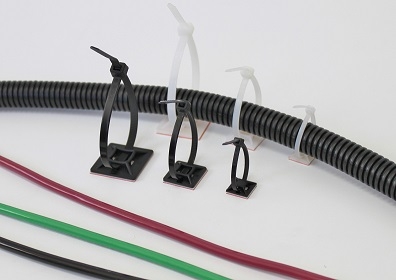 Cable management clips holding various colored wires and a corrugated cable sleeve.