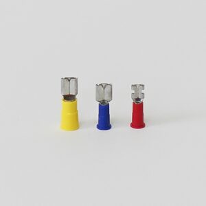 Three insulated electrical connectors in yellow, blue, and red arranged in a row.