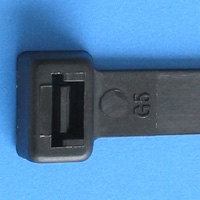 Black plastic cable tie or zip tie on blue background.