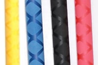 Four fabric swatches displaying yellow, blue argyle, black quilted, and pink textured patterns.