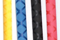 Four fabric swatches in yellow, blue argyle, black quilted, and pink colors.