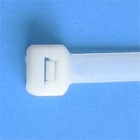 White cable tie on a blue background.