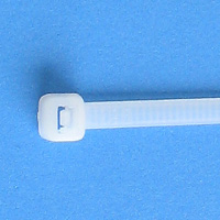 White cable tie on a blue background.