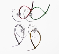 Four curved wire or metal shapes arranged in a loose grid pattern.
