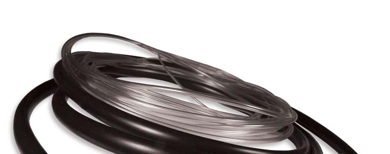 Coiled black cable or cord on a white background.