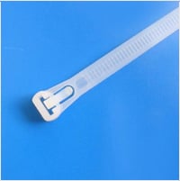 Clear plastic tube with white threaded connector on blue background.