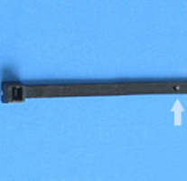 Black rifle barrel and stock against a blue background.