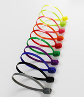 Colorful hair clips arranged in a diagonal line on a white background.