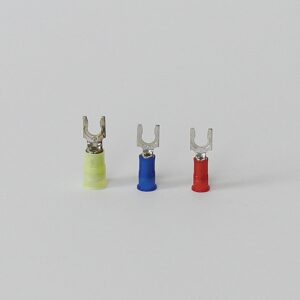 Three spade terminal connectors in yellow, blue, and red on a white background.