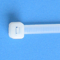 White cable tie with locking mechanism on blue background.