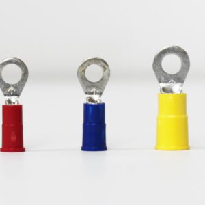 Three insulated ring terminals in red, blue, and yellow arranged in a row.