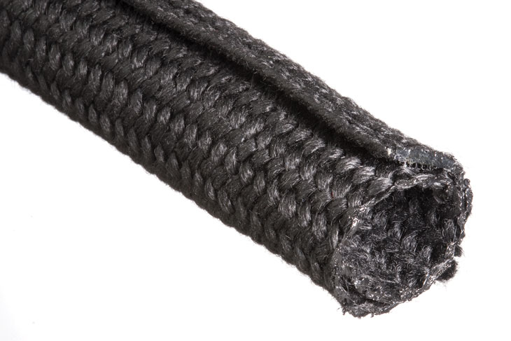 Black braided nylon hose or tubing coiled diagonally on a white background.